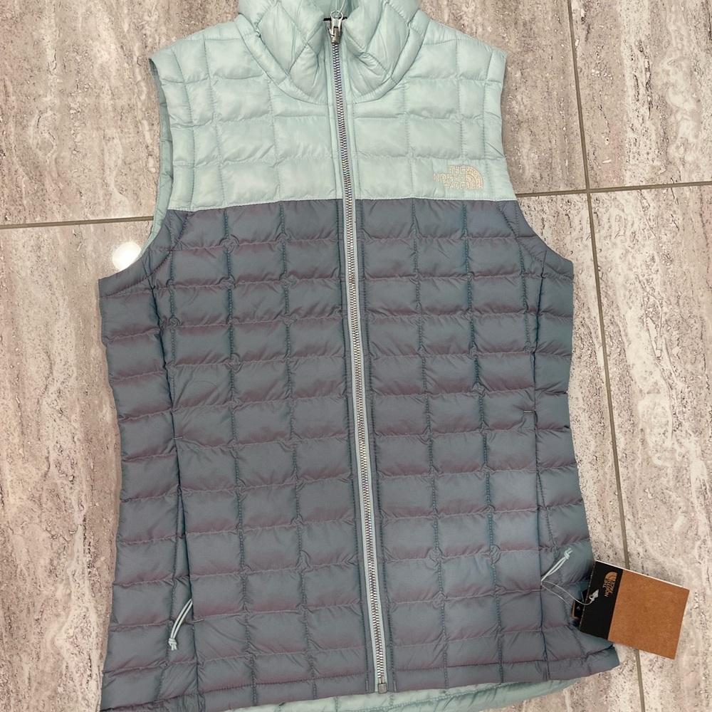 The North Face puffer vest, never worn, size xs